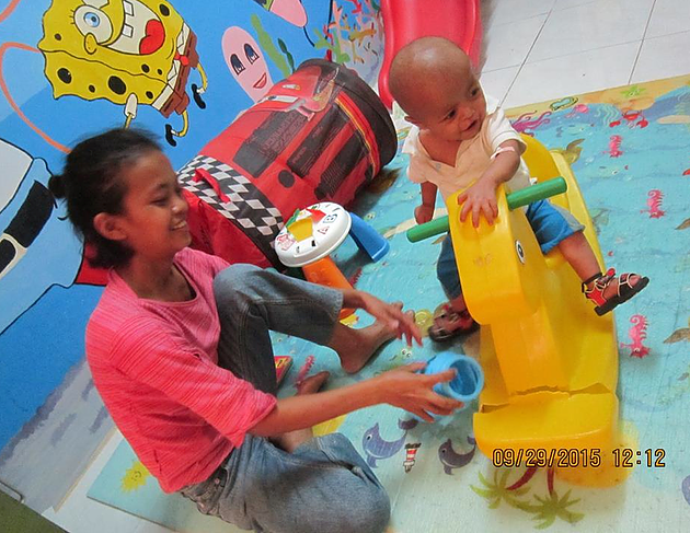 A young mom with her malnourished son 