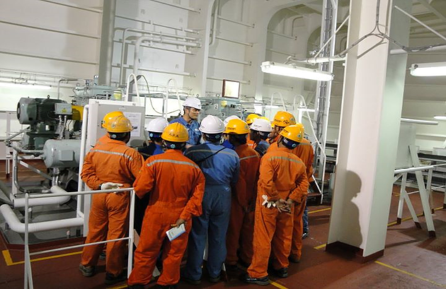 Burmese sailors working in a group