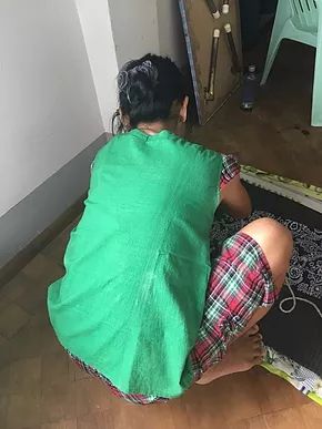 A Myanmar girl doing house work